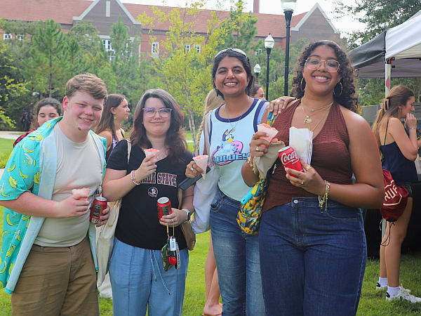 students holding drinks and treats
